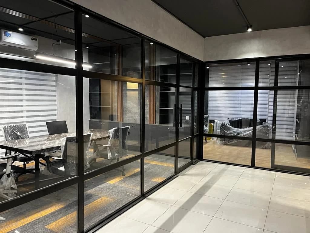 Black-framed glazed office partitions from the Steed Art company profile